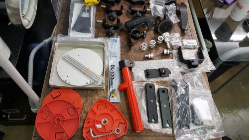 LOT VARIOUS TOPCON, LEICA, SPECTRA, HOLDING CLAMPS, HANDLES ACC ETC