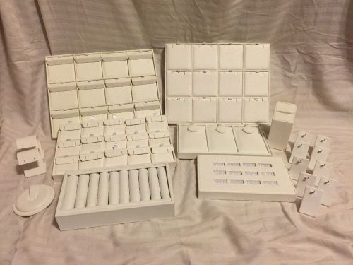 Nineteen Piece White Faux Leather Jewelry Displays