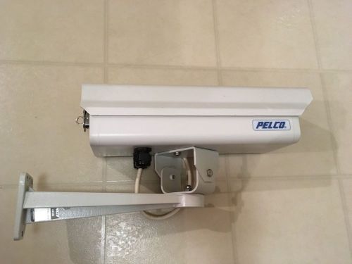 Pelco EH3512 Security Camera with housing, mount bracket, and arm