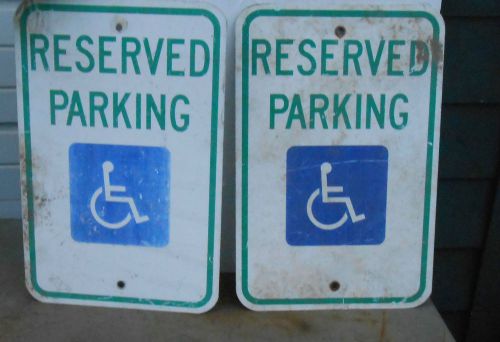 2  reserved parking w/ blue handicapped symbol sign green on white used 12 x 18 for sale