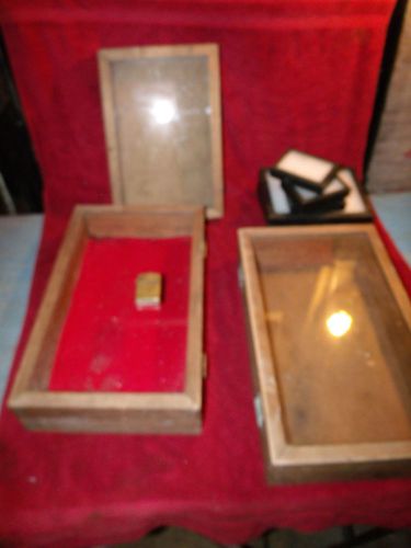 Three wooden display cases
