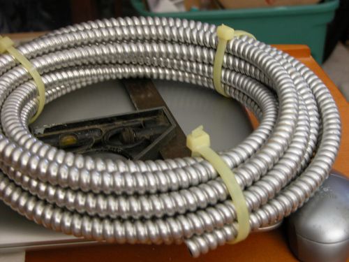 APPROXIMATEY 20 FEET OF 3/8 INCH FLEXIBLE ELECTRICAL CONDUIT