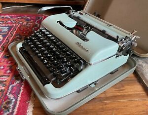 1954 Olympia SM4 &#034;S&#034; Baby Blue crackle finish portable typewriter with case