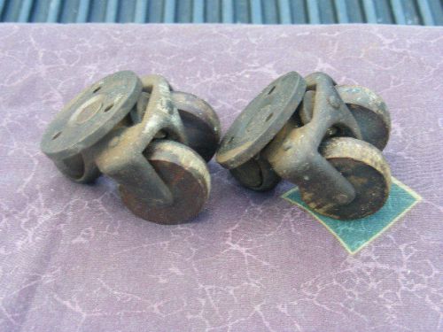 Antique cast iron and wood swivel wheels lot of 2 industrial for sale