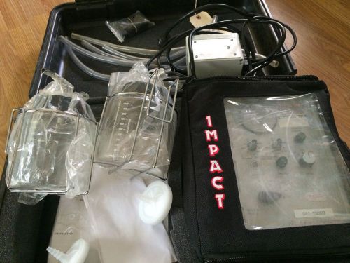 Impact model 326m portable suction apparatus with charger and supplies for sale