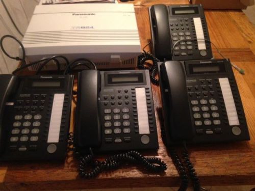 PANASONIC KX-TA824 PHONE SYSTEM with 4 KX-T7731 BLACK PHONES