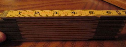 vintage Craftsman folding six foot wooden measure with brass joints