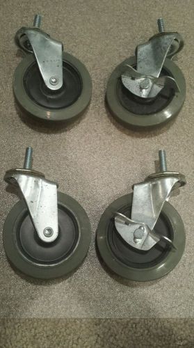 Set of four used swivel casters wheels threaded stem 4&#034; wheels. for sale