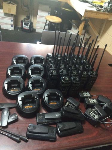 22 motorola axu4100 uhf portable radios, 8 chargers and  extras closeout lot for sale