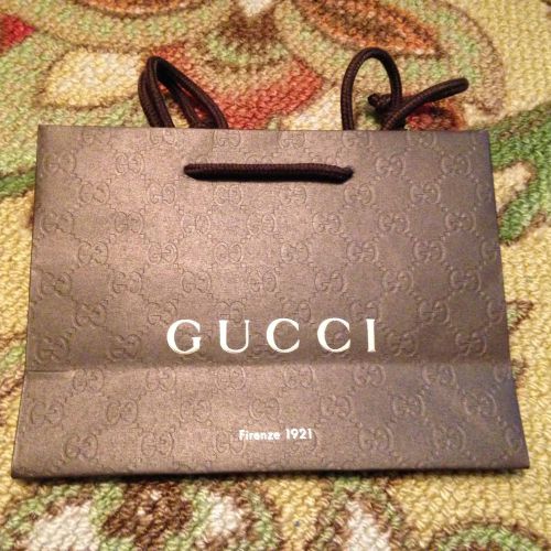 Embossed paper gift, shopping bag from Gucci designer store
