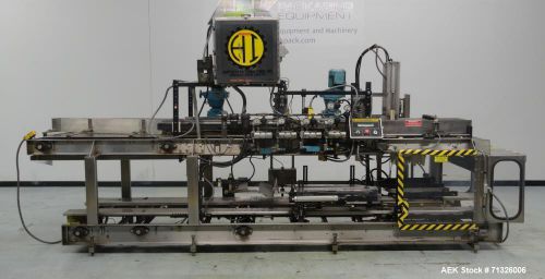 Used- Hartness Model 825 Automatic Drop Case Packer. Machine is capable of speed