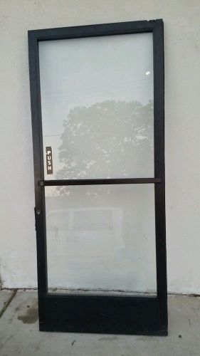 COMMERCIAL STORE FRONT GLASS AND ALUMINUM DOOR