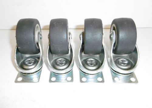 Set of 4 swivel plate casters wheels 2&#034;x 7/8 &#034; plate 1 1/4&#034;x 2&#034; exc cond.1005 for sale