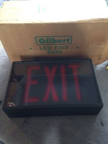 New In Original Box Gilbert LED Light Up EXIT SIGN. Black W Red Bulbs.