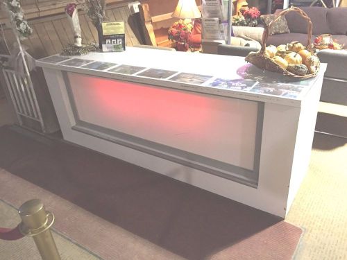 Buffet Table With Red Front Under Lighting
