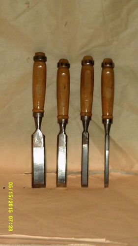 A SET OF FOUR CHISELS THEY ALL HAVE NICE WOODEN HANDLES