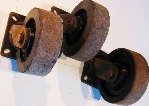 Trio of used rubber wheel industrial swivel casters