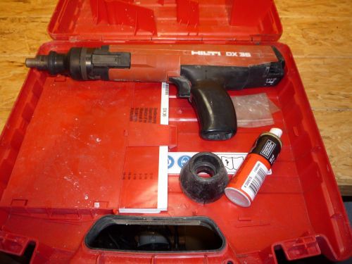 Used Hilti DX 36 power actuated fastener with case, brush, manual...
