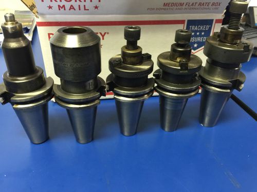 5 VARIOUS CAT 40 TOOL HOLDERS WITH TWO RETENTION KNOBS.