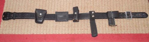Dutyman size 38 duty belt with cuff radio &amp; other  pouches for sale