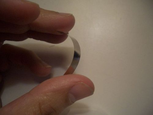 Small metal shim, very thin, flexible, attracts to a magnet