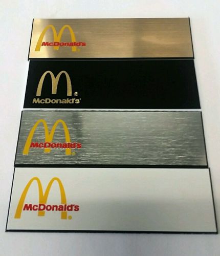 McDonalds Name badge up to 2-lines engraving and a pin back included.