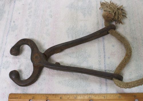 VINTAGE BULL COW NOSE RING LEAD METAL TOOL WITH ORIGINAL ROPE - FARM BARN FIND