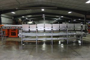 Large stainless steel 16 position workstation with conveyors for sale
