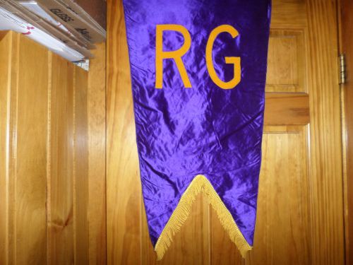 Triangular Shaped Purple Banner Monogrammed R G in yellow cloth Fencing Banner