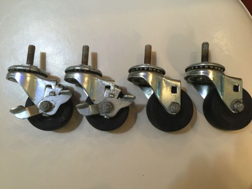 Set of (4) 2 inch casters - 2 with brakes - good condition for sale
