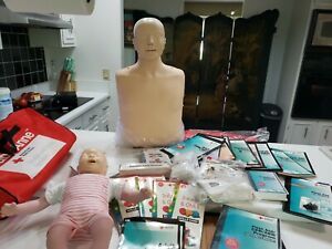 Laerdal adult male &amp; Baby Anne CPR manikins set w/ books face Shields, vhs