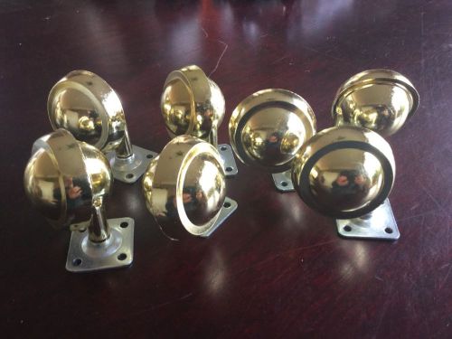 Lot of seven plate mount brass ball swivel casters for sale