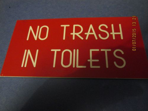 No trash in toilets sign red