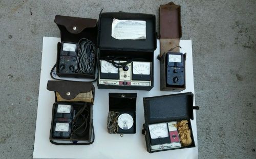Assortment of vintage multimeters and testing equipment