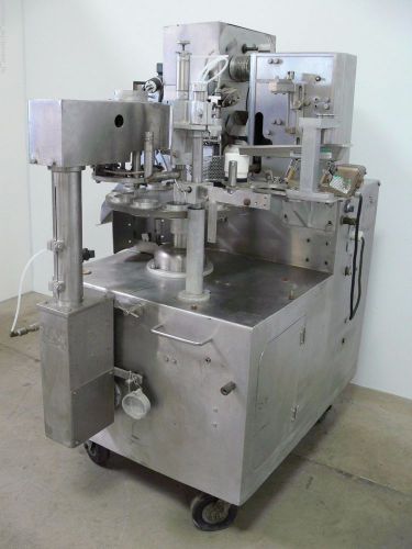 Rotary vibratory cup filler w/ filling head, heat seal &amp; syntron magnetic feeder for sale