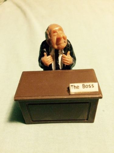 Small Plastic Desk With Old Business Man Sitting At Desk Name Plate Says The Bos