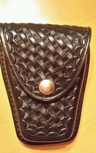 Gently used leather handcuff pouch holder for police force belt basket weave for sale