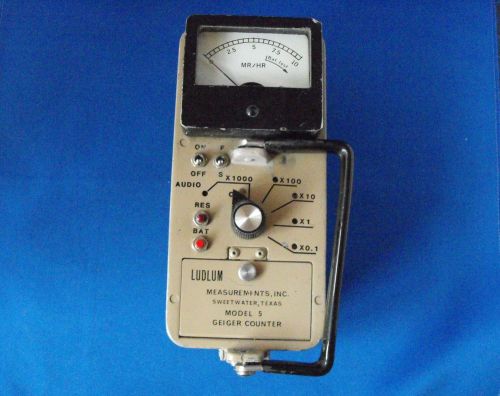 Ludlum Model 5 geiger counter with uranium ore test source