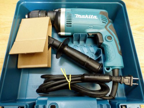 Makita Rotary Hammer Drill H1631 with case, woman used