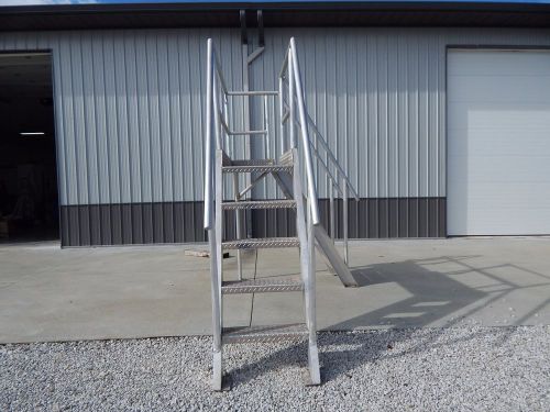 Aluminum mezzanine work platform with stairs used to load a grist brewing mill