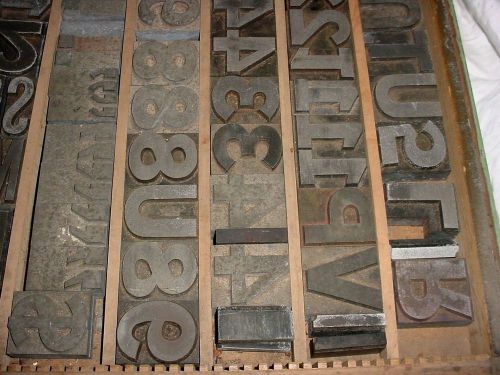 Vintage typeset drawer filled aluminum blocks stamps printers numbers letters for sale