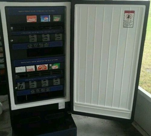 Antares Refrigerated Soda On 1 Side And Snack Vending Machine On The Other Works