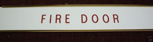 Engraved door sign FIRE DOOR with holder