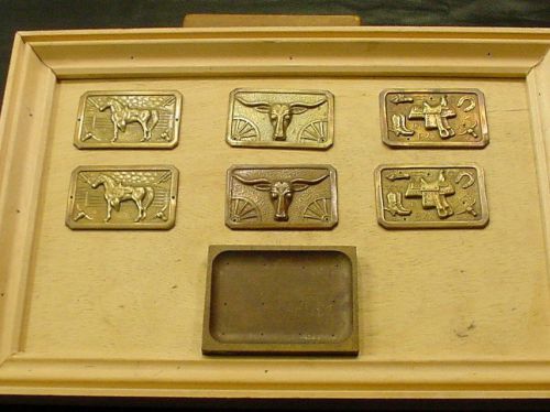 #11 An interesting assortment.  Used for vacuum forming?? Made into belt buckles