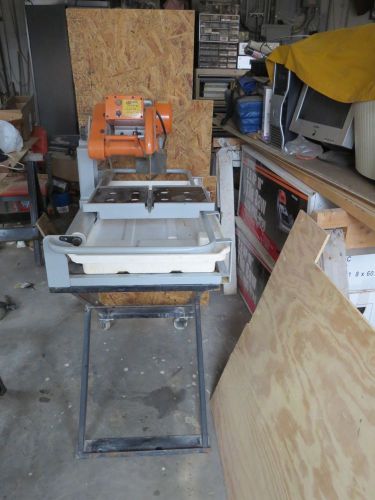 TILE SAW AND STAND (USED)