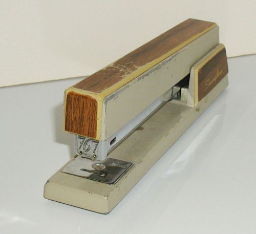 Vintage model 767 swingline metal stapler with plastic wood grain finish for sale