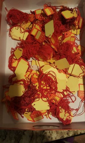 Lot of retail tags with attached string. Sale Tags for retail