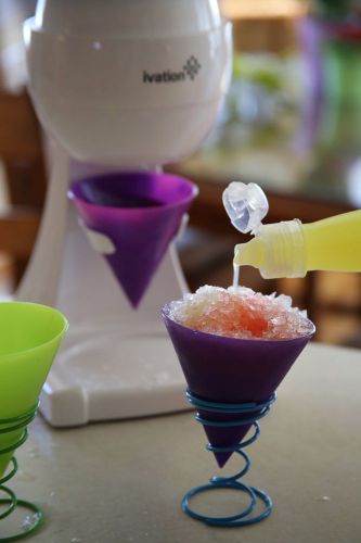 Ice shaver making delicious flavored snow cones, crushing ice cubes for kids new for sale