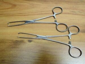 2 STAINLESS SURGICAL FORCEPS