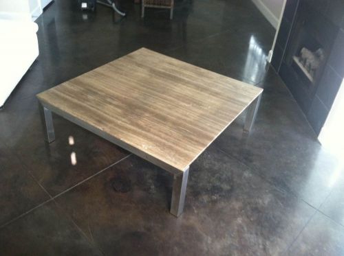 Contempoary cocktail table.  Natural Stone on stainless steel 48 X 48